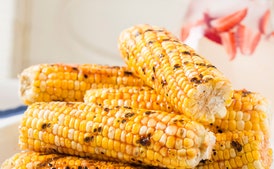 Prepare Honey-Ginger Barbecue Sauce and divide equally into two bowls.
Prepare grill for direct-heat cooking over medium-hot charcoal (medium-high for gas); see Grilling Procedure. .
Drizzle corn with oil on a large rimmed baking sheet, and sprinkle evenly with salt. Lightly rub oil and salt into corn.
Oil grill rack, then grill corn (covered only if using gas), turning frequently, until lightly browned and tender, 6 to 8 minutes. Move corn to different positions on grill if hot spots are present. Brush corn with some of prepared sauce and grill, turning, until sauce is hot, 1 to 2 minutes. Serve with reserved sauce.